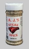 A bottle of aj 's steak spice with a picture of a steak on the label.