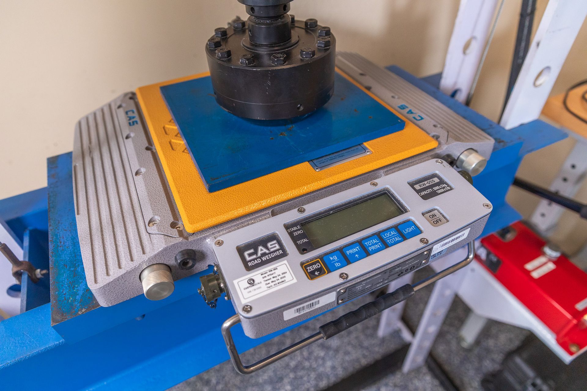 A close-up of a CAB ST-50 machine with a digital display.