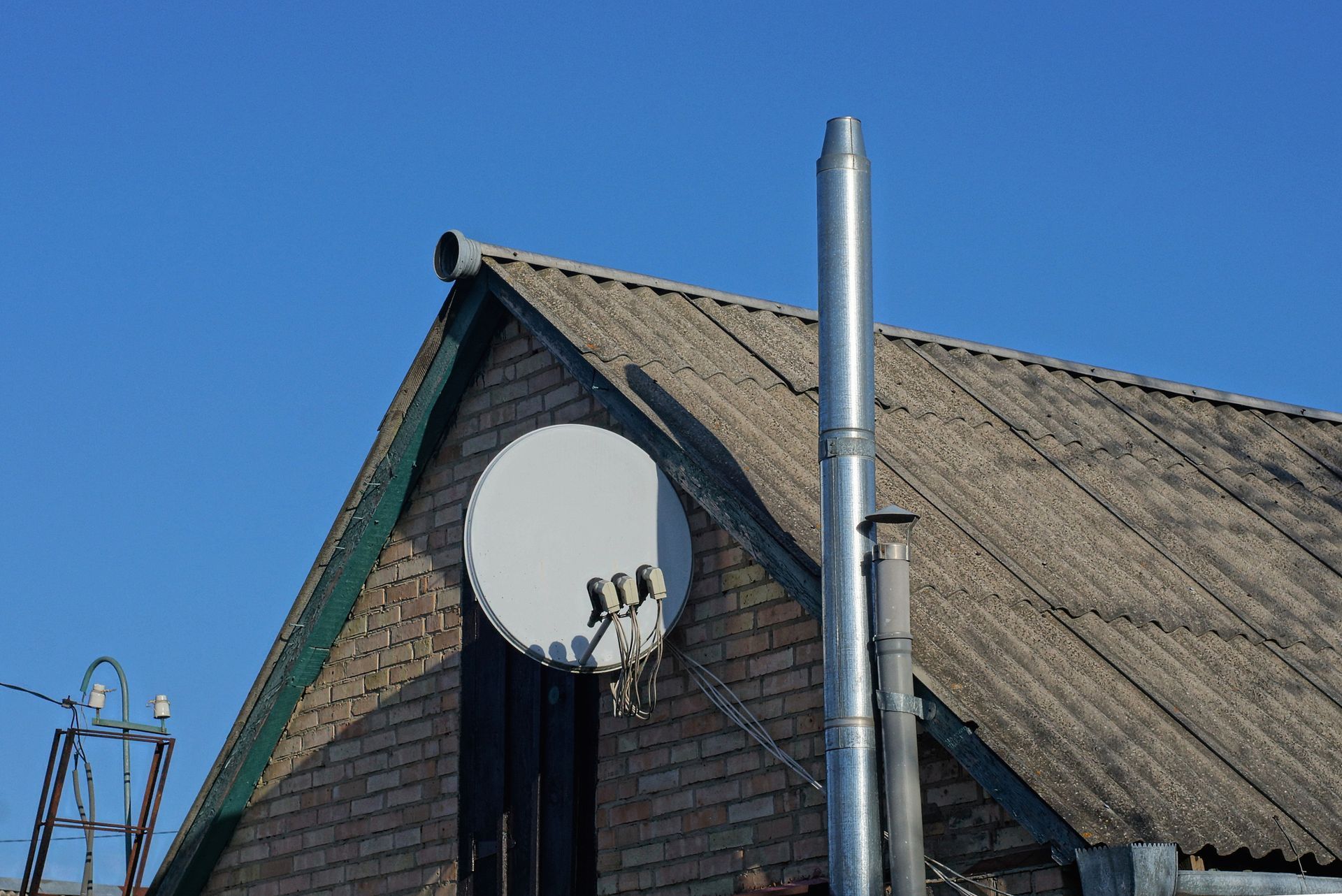 Tiled Roof With Brick Chimney — Centralia, WA — CDW Construction, LLC