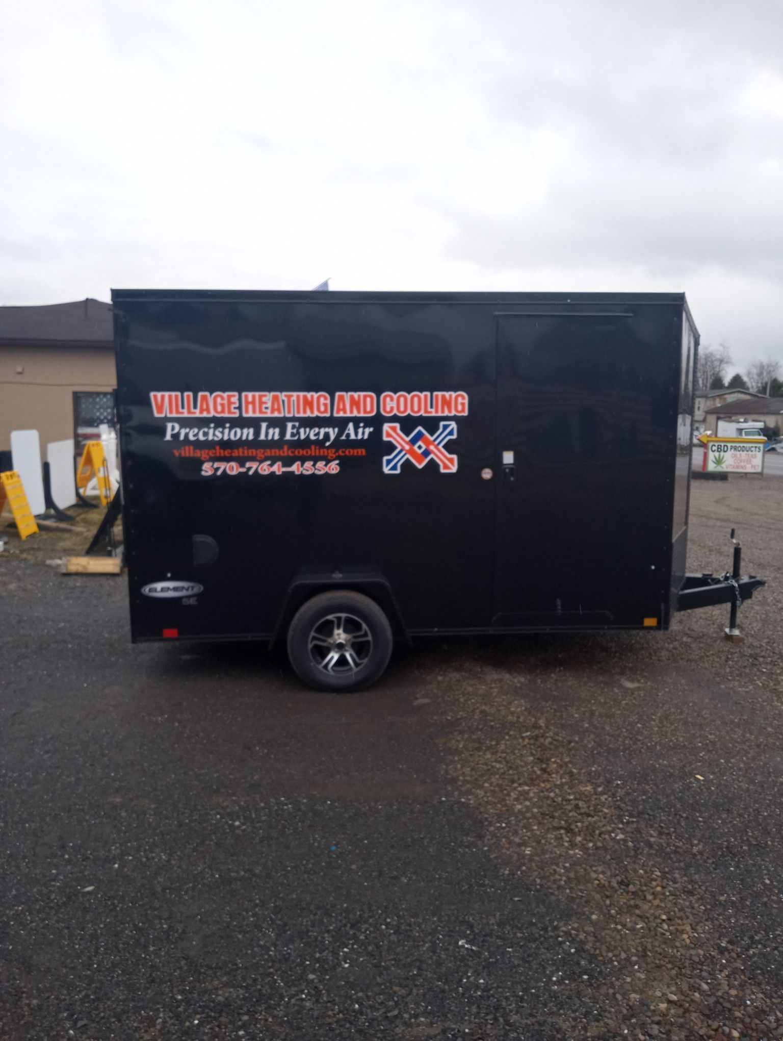 Black trailer with business logo: 
