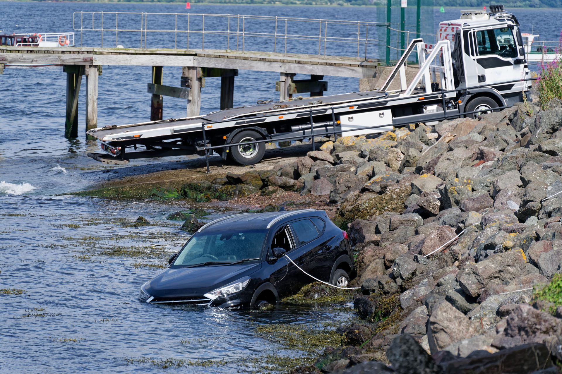 Tow truck recovering underwater vehicle