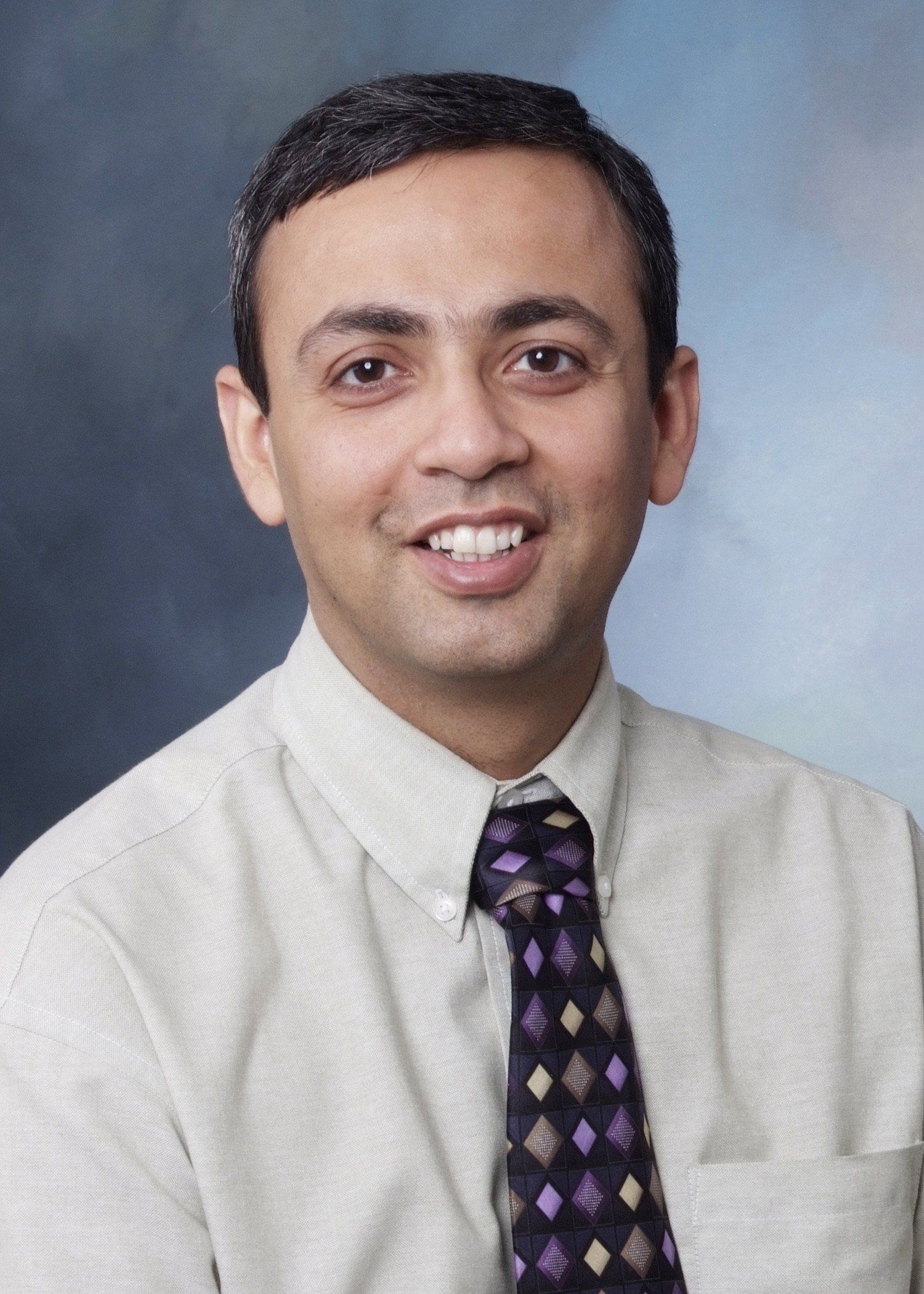 headshot of UP board member Dr. Gaurav Kapur