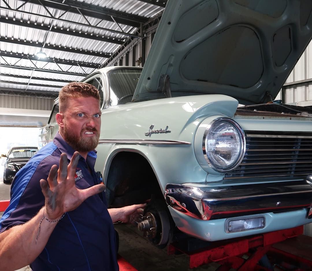 Auto Mechanic Fixing Vintage Car — Gold Coast Service Centre In Southport, QLD