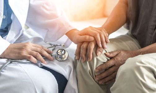 doctor and patient consoling