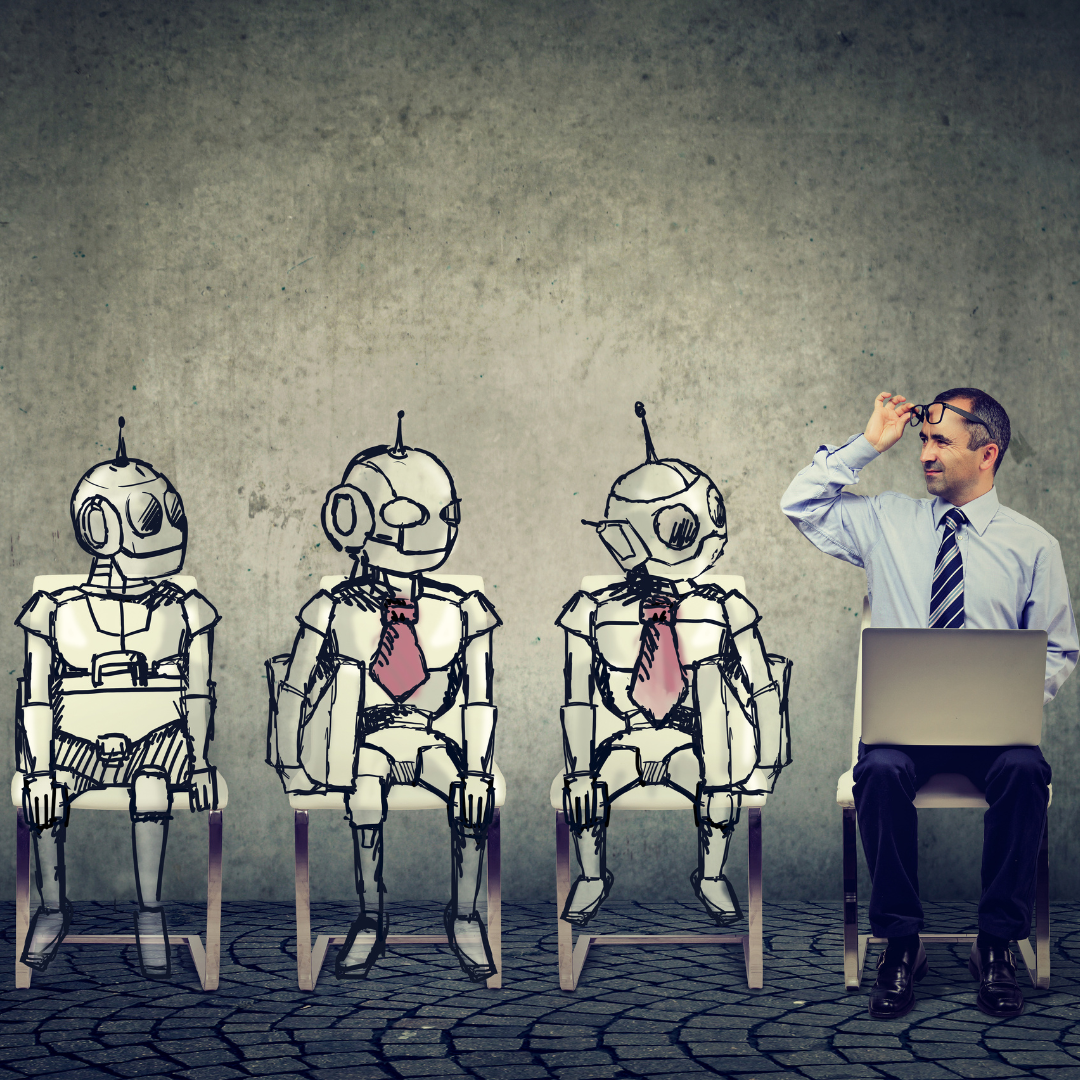 Man with laptop interviewing drawn robots seated on chairs. Gray background.