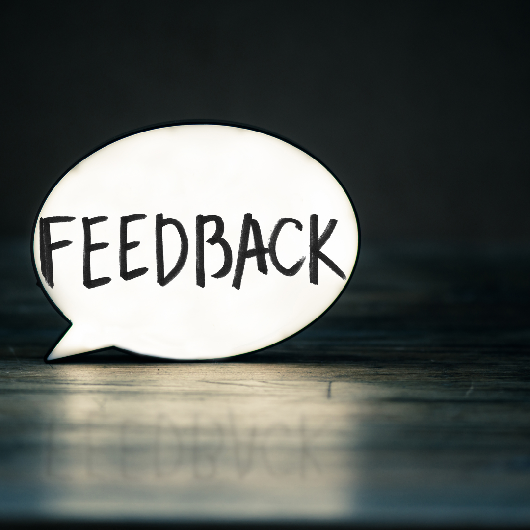 A white, oval speech bubble featuring the word 