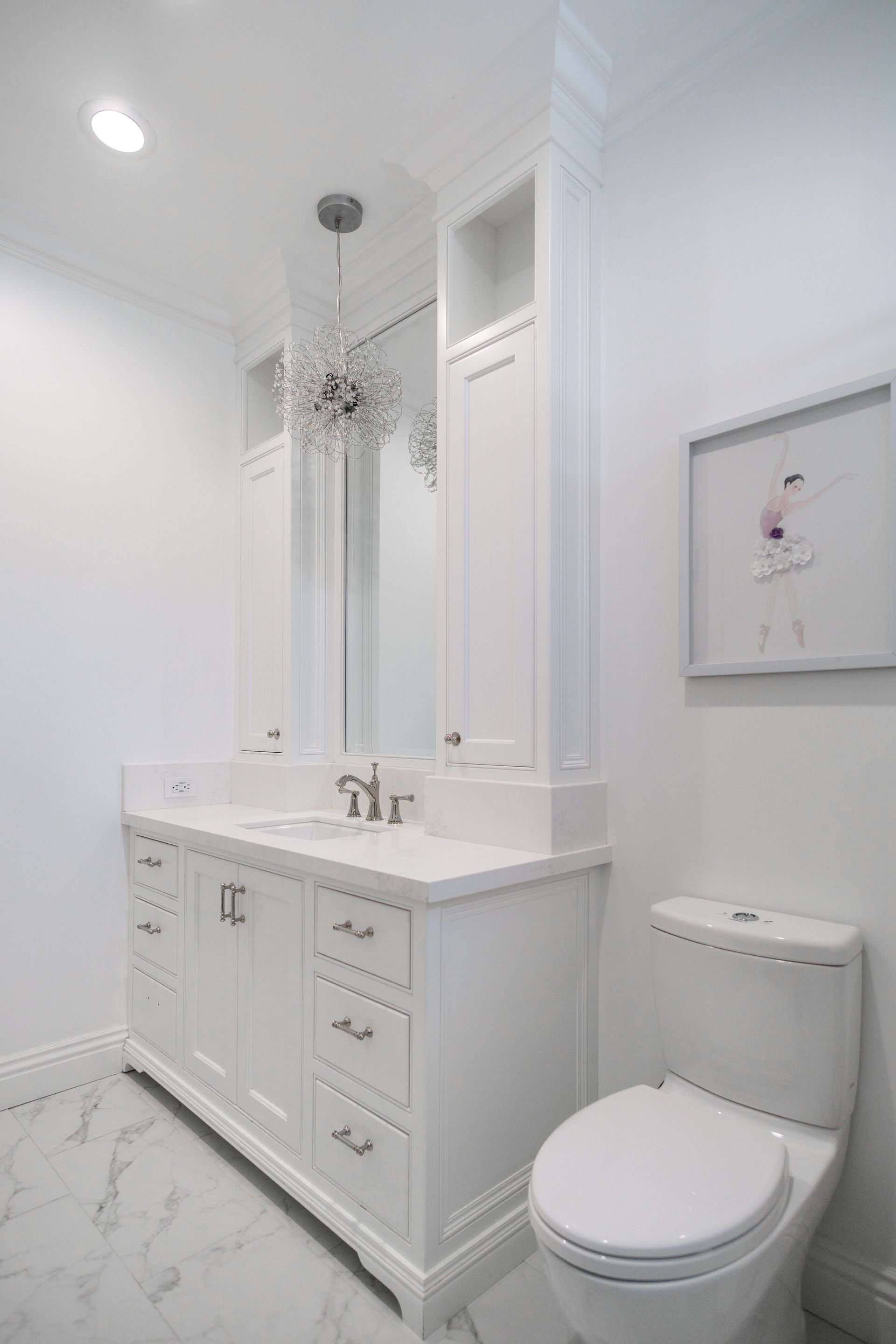 bathroom remodel with custom white cabinetry