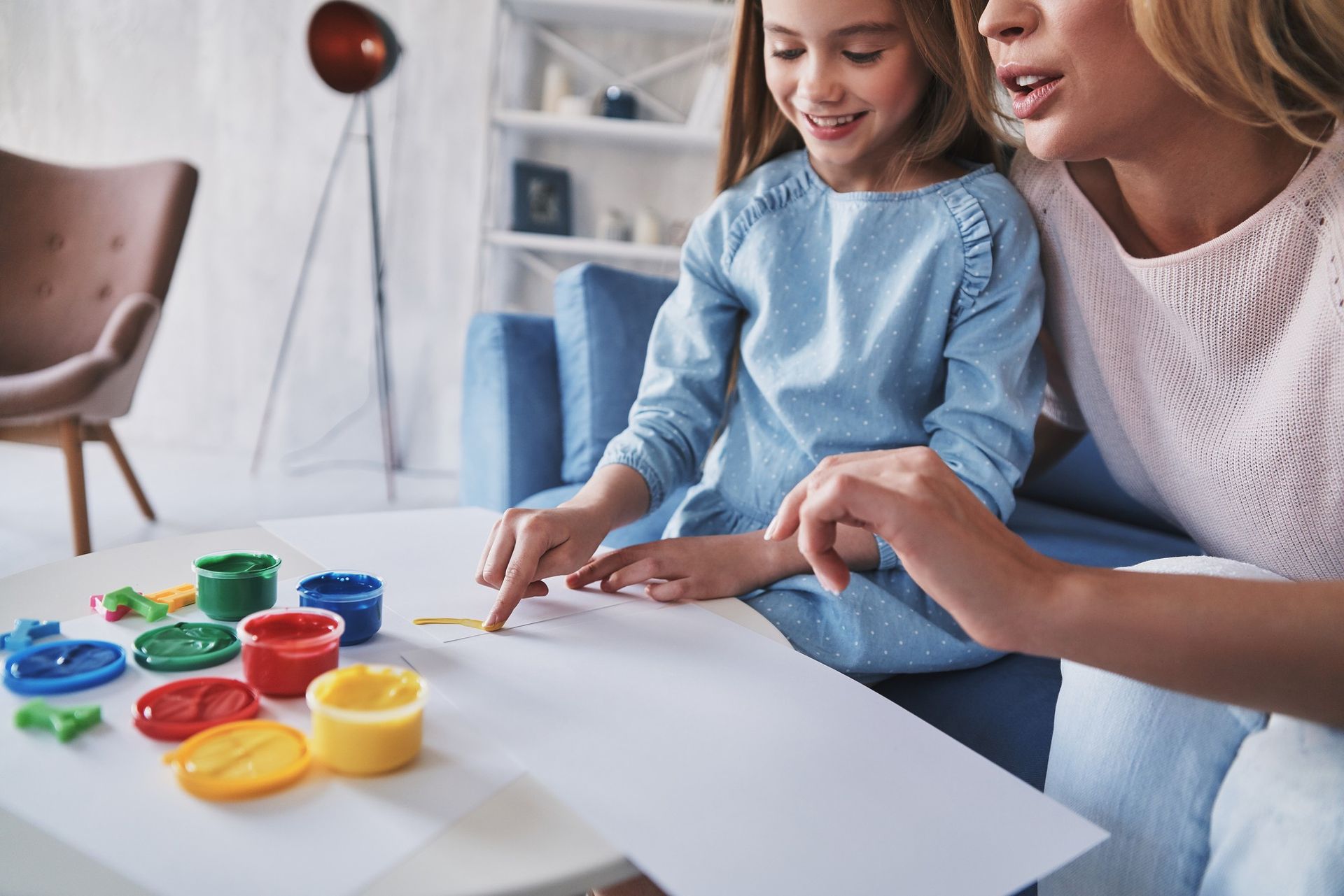 A woman and a little girl during an in home ABA therapy session
