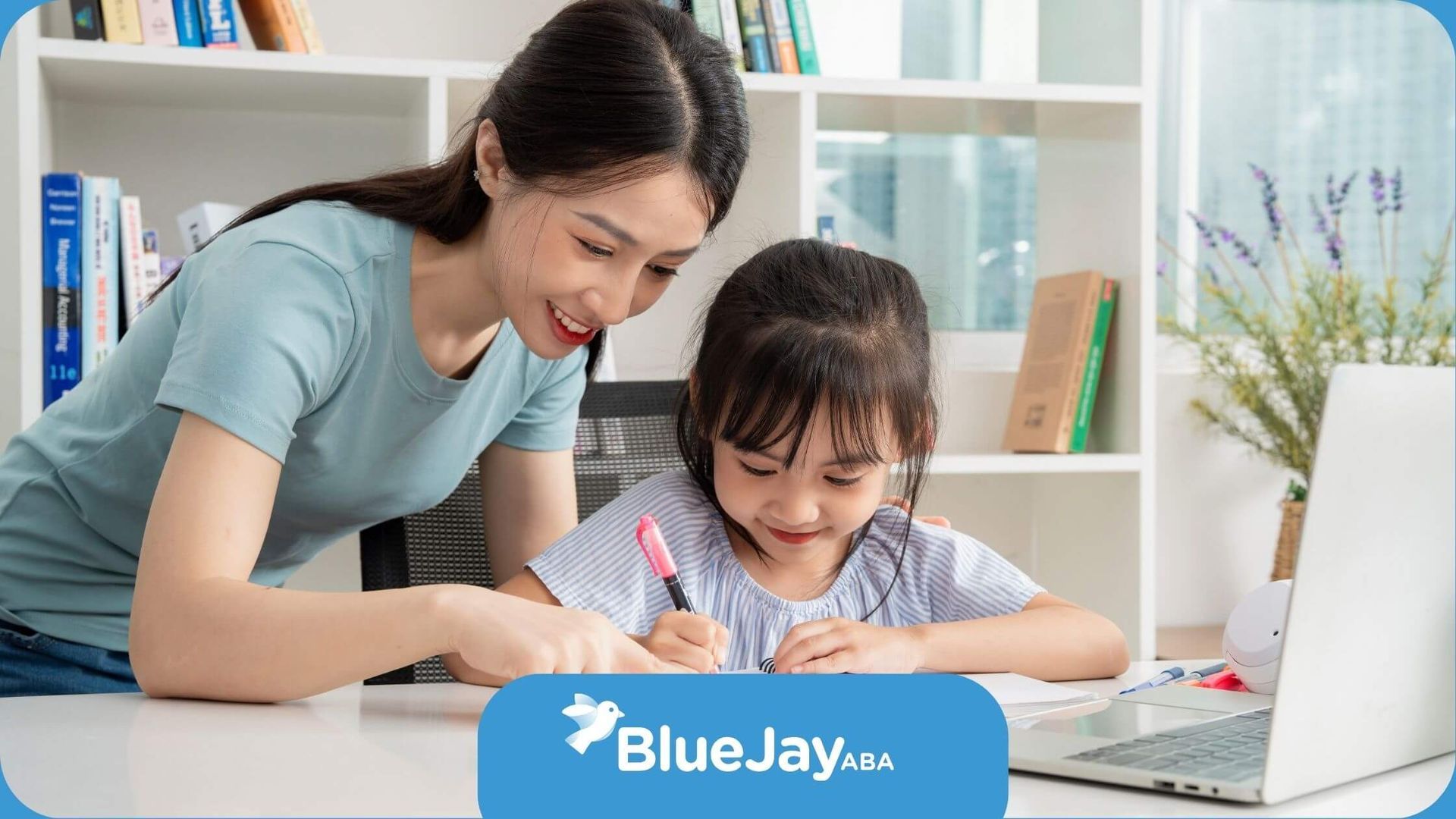 A BCBA is helping a little girl with her task to improve writing skills.