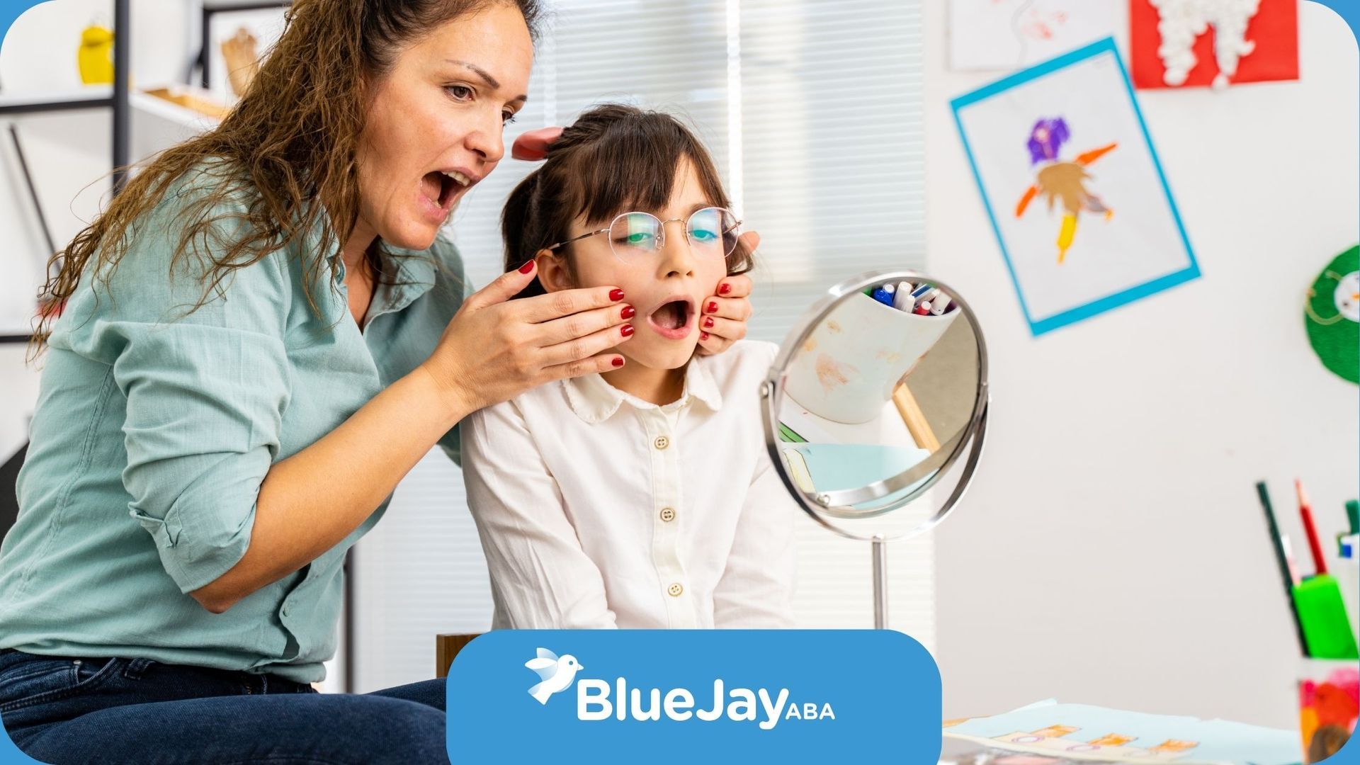 A woman is looking at a child 's face in a mirror.