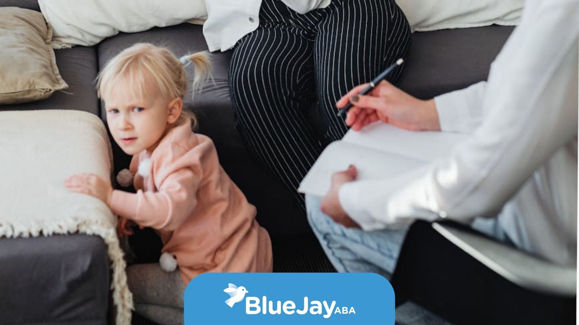 Crying mother during high-functioning autism assessment of her autistic child with a BCBA nearby.