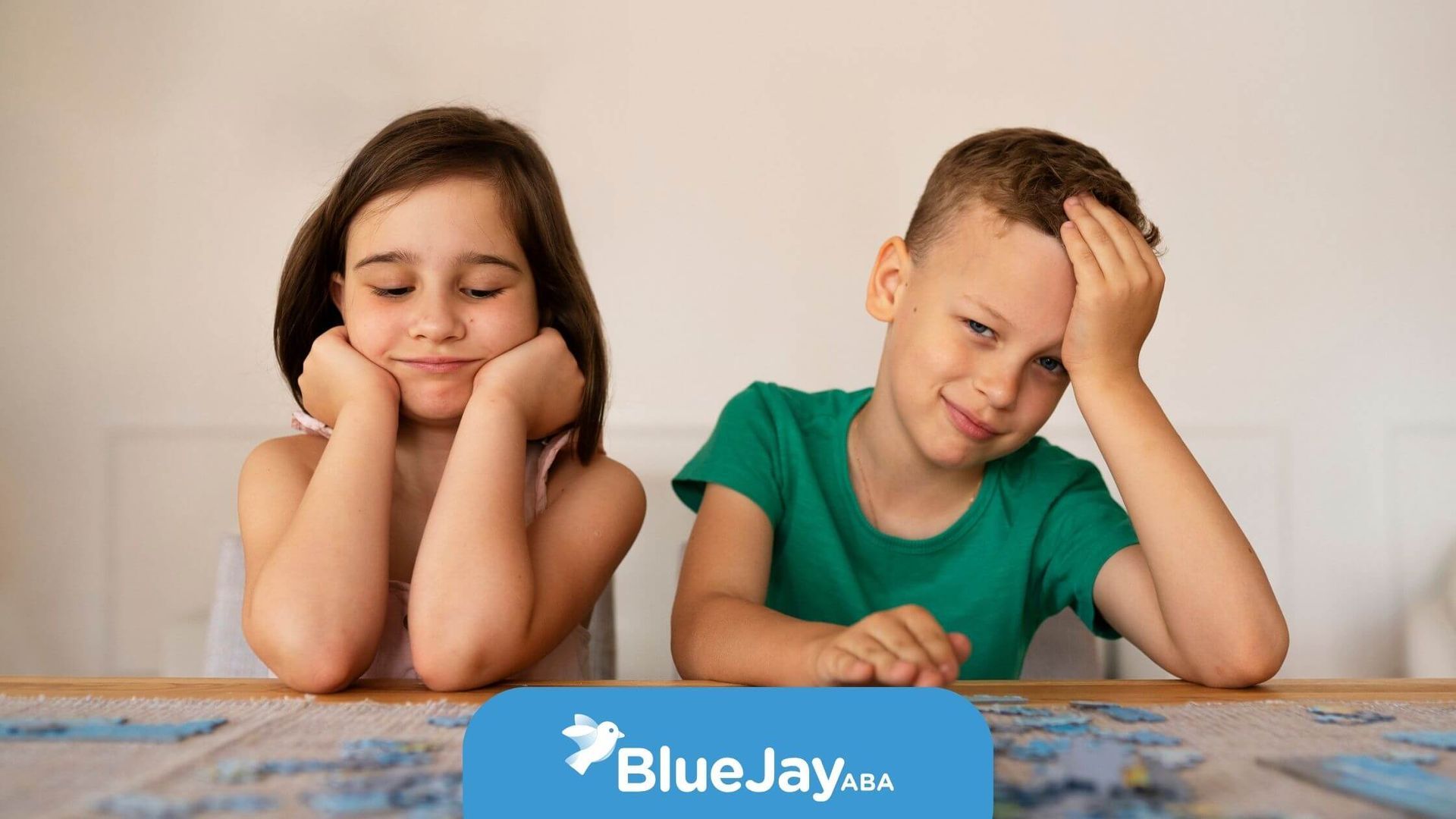 Two autistic children looking frustrated as they try to solve a challenging jigsaw puzzle.