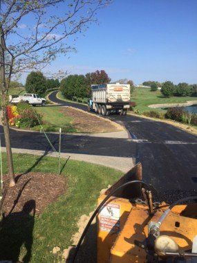 Yellow road roller — Voelker Paving INC In Butler, PA