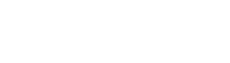 A white, sleek, modern bathroom vanity with a basin sink, chrome faucet, and a large, backlit circular mirror.