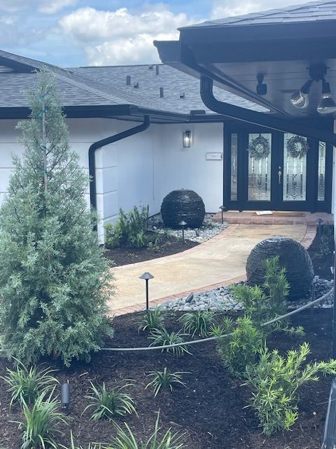 A house with a walkway leading to the front door