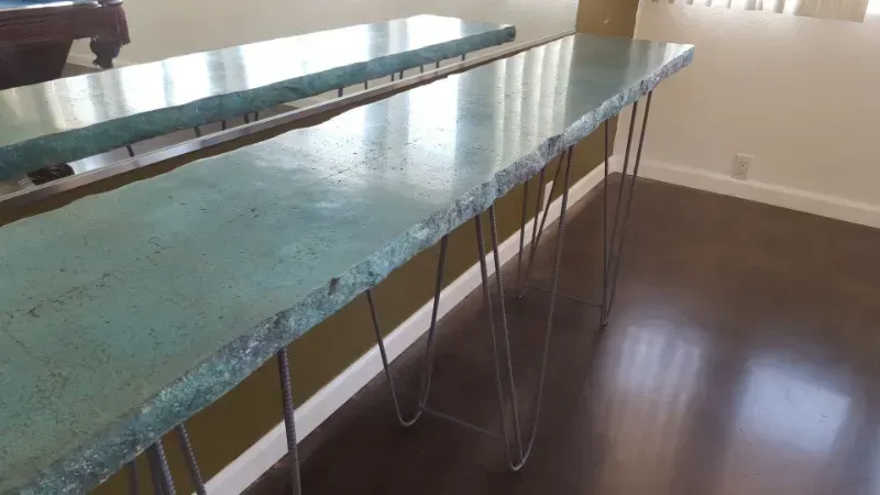 A long table with hairpin legs in a living room