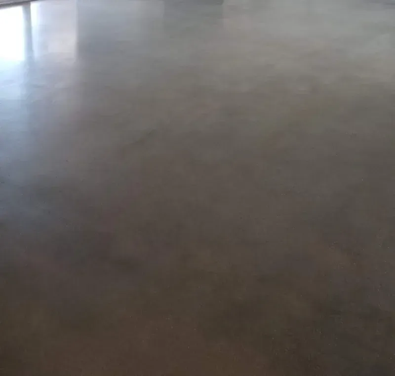 A close up of a concrete floor in a room.