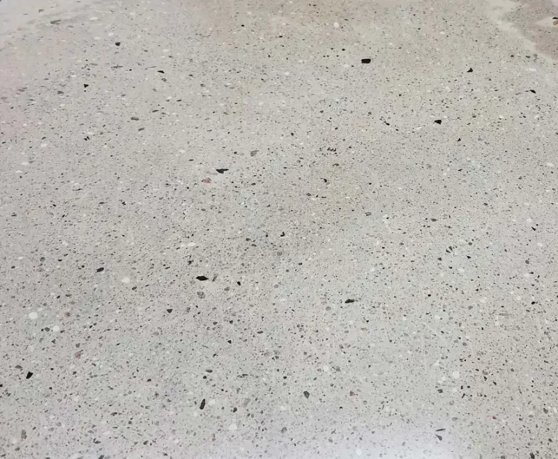 a close up of a polished concrete floor with a lot of small stones on it in Palm Springs CA.