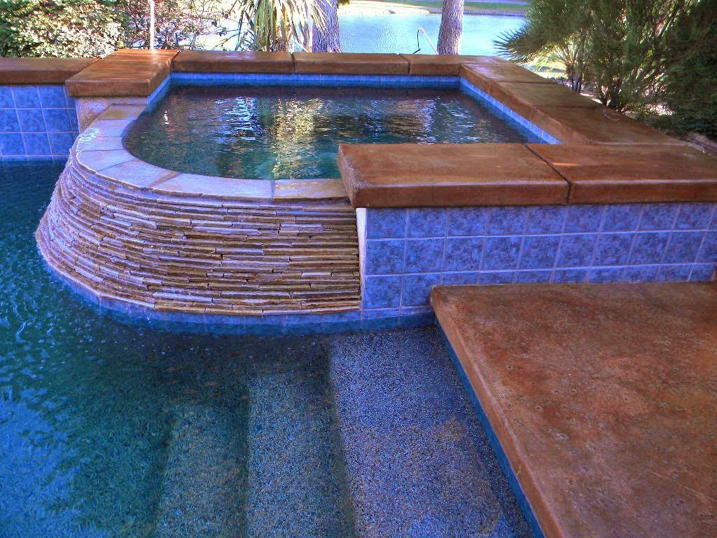 A swimming pool with stairs leading up to it