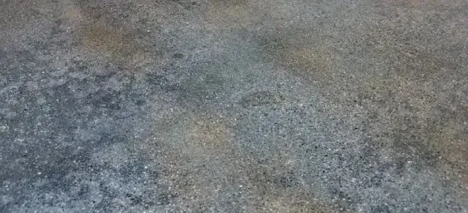 a close up of a stained concrete floor in Yucca Valley, South California.