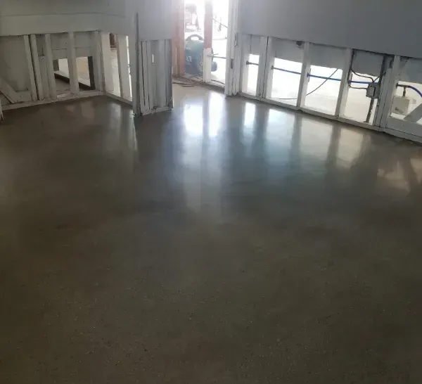 A large room with concrete polished floors in Yucca Valley CA.