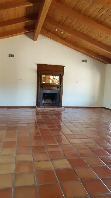 There is a fireplace in the middle of the room.