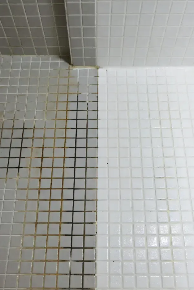 Dirty tile wall, contrasted with clean tile wall, showing cleaning results.