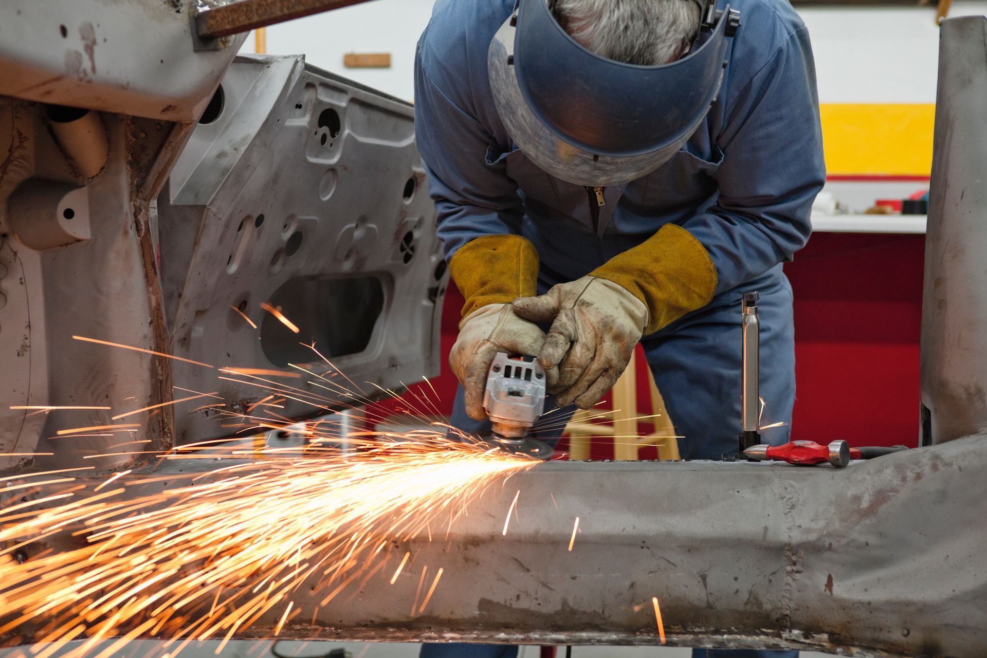 Expert artisan performing precise steel fabrication to create custom gates