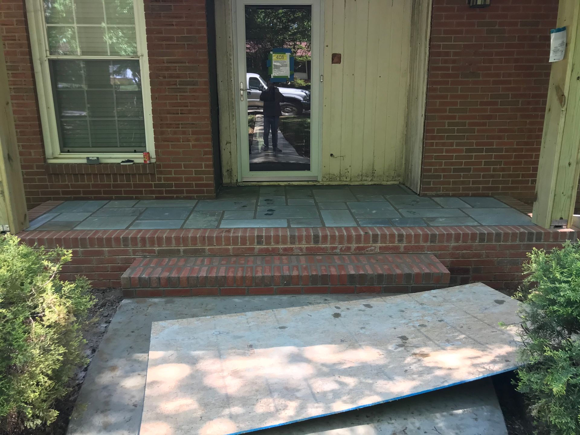 A brick house with a ramp in front of it