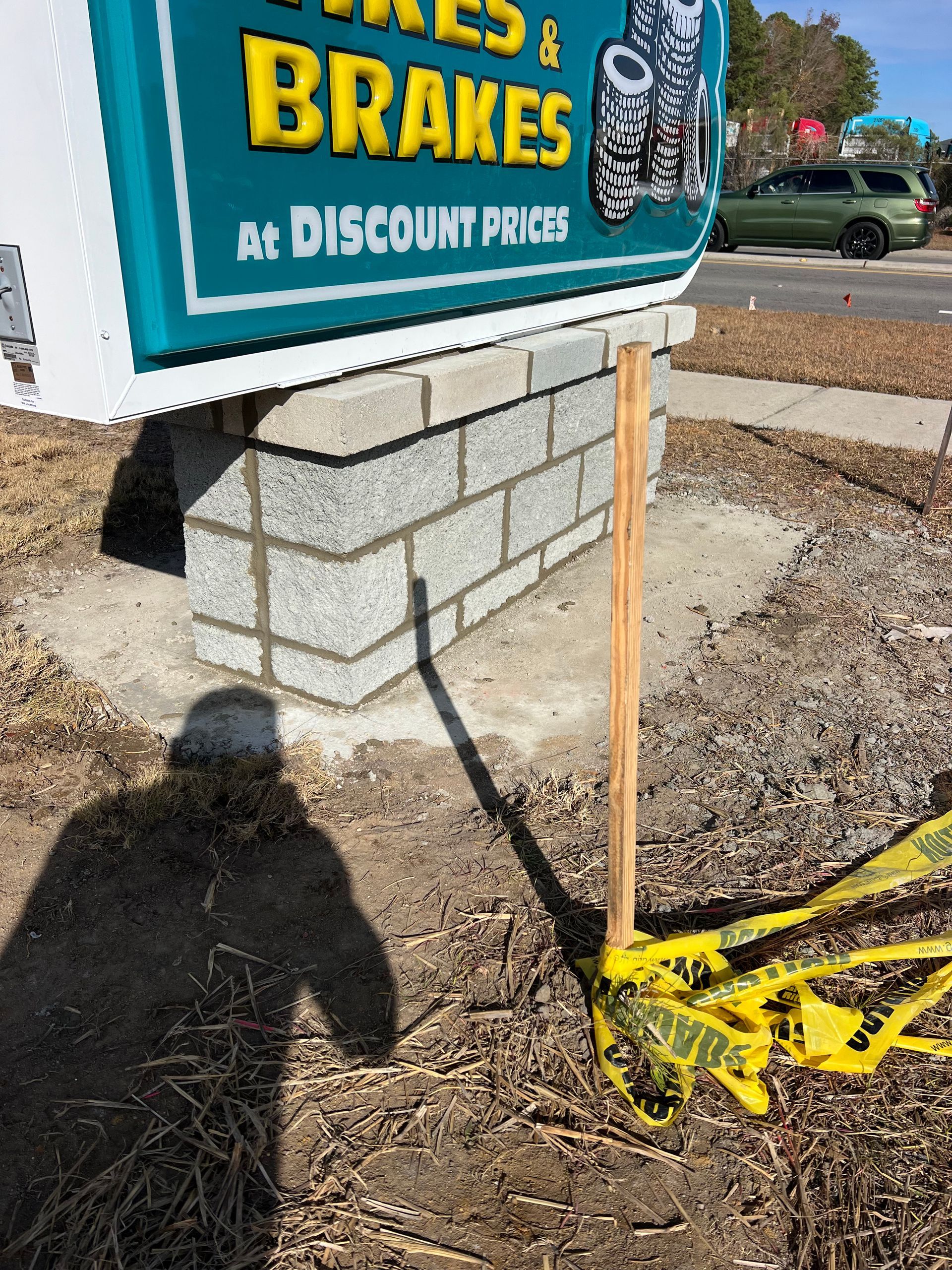 A sign that says tires and brakes on it