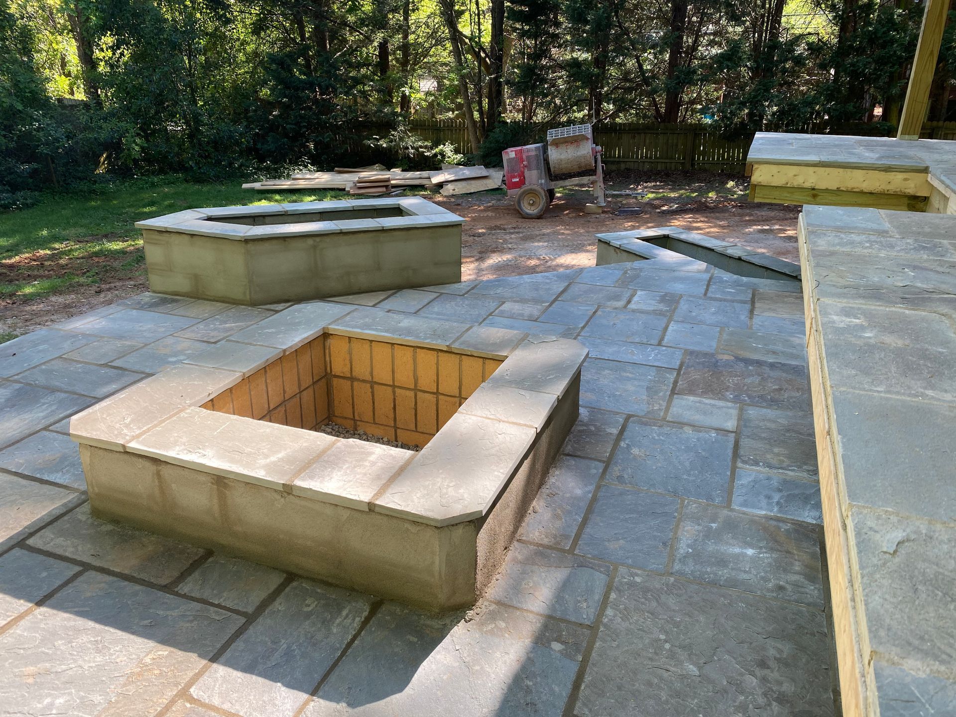 There is a fire pit in the middle of the patio.