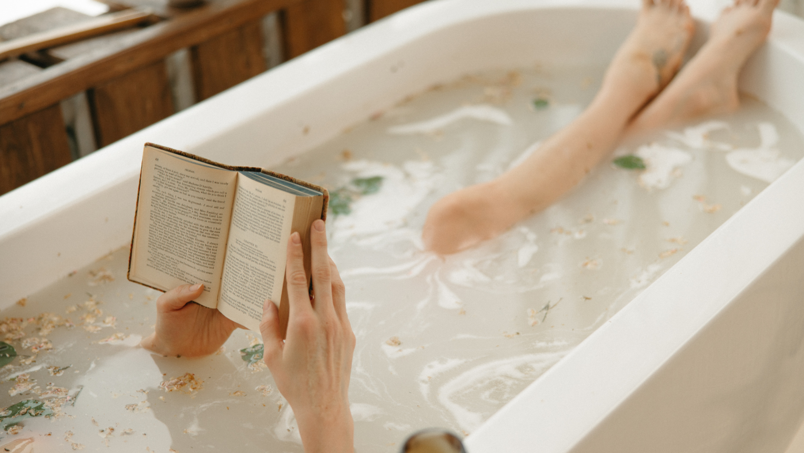 A woman is taking a bath.