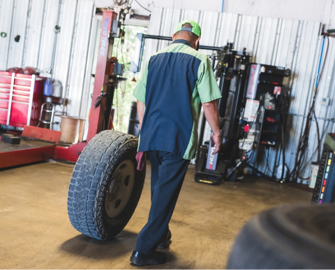 Mechanic a tire through a repair shop. | Pro Tire & Automotive Center