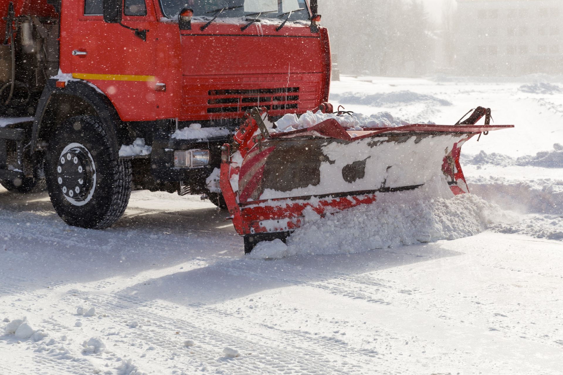 A close up of a snow plow in action