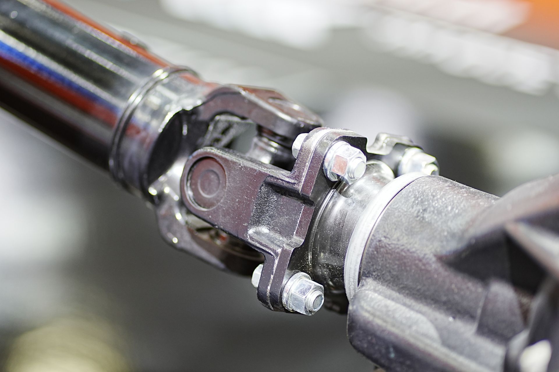 Upgraded drive shaft assembly connected to wheel for better performance.
