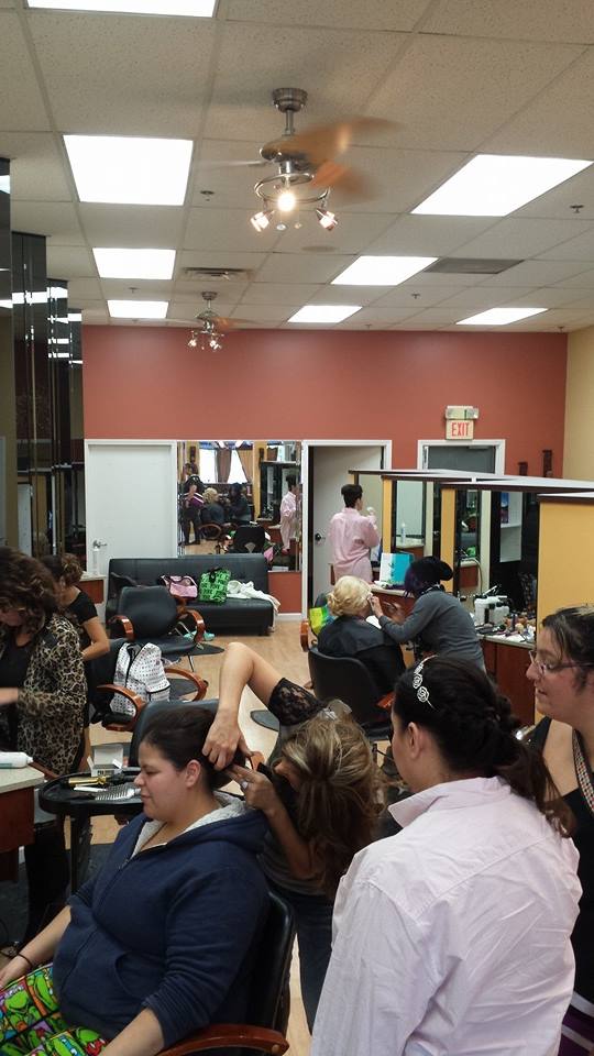 A group of women are getting their hair done in a salon