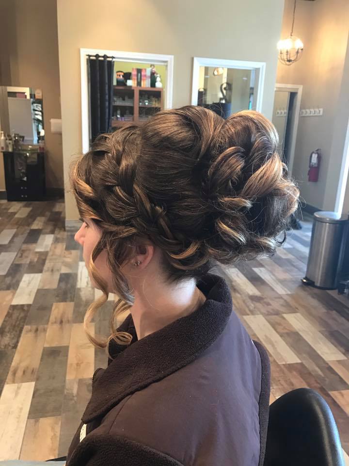 A woman is getting her hair done in a salon.