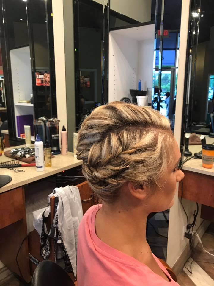 A woman is getting her hair done in a salon.
