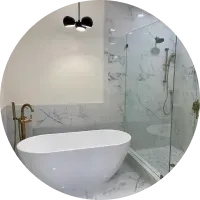 A bathroom with a bathtub and a shower stall.