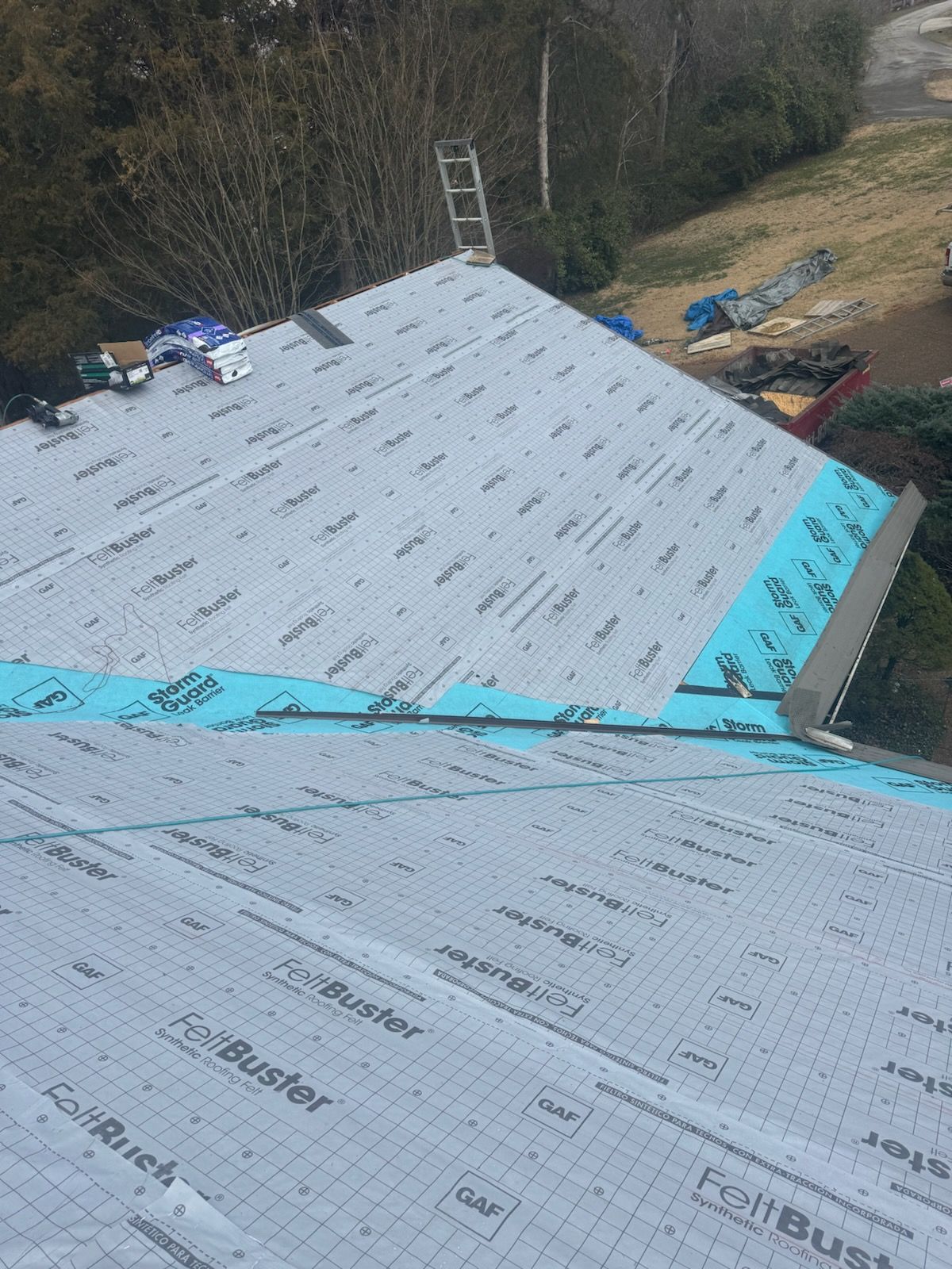 An aerial view of a roof that is being installed.