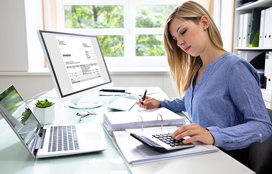 Woman Checking the Invoices — Allen, TX — Newton Buckley, CPA Woman Checking the Invoices — Allen, TX — Newton Buckley, CPA