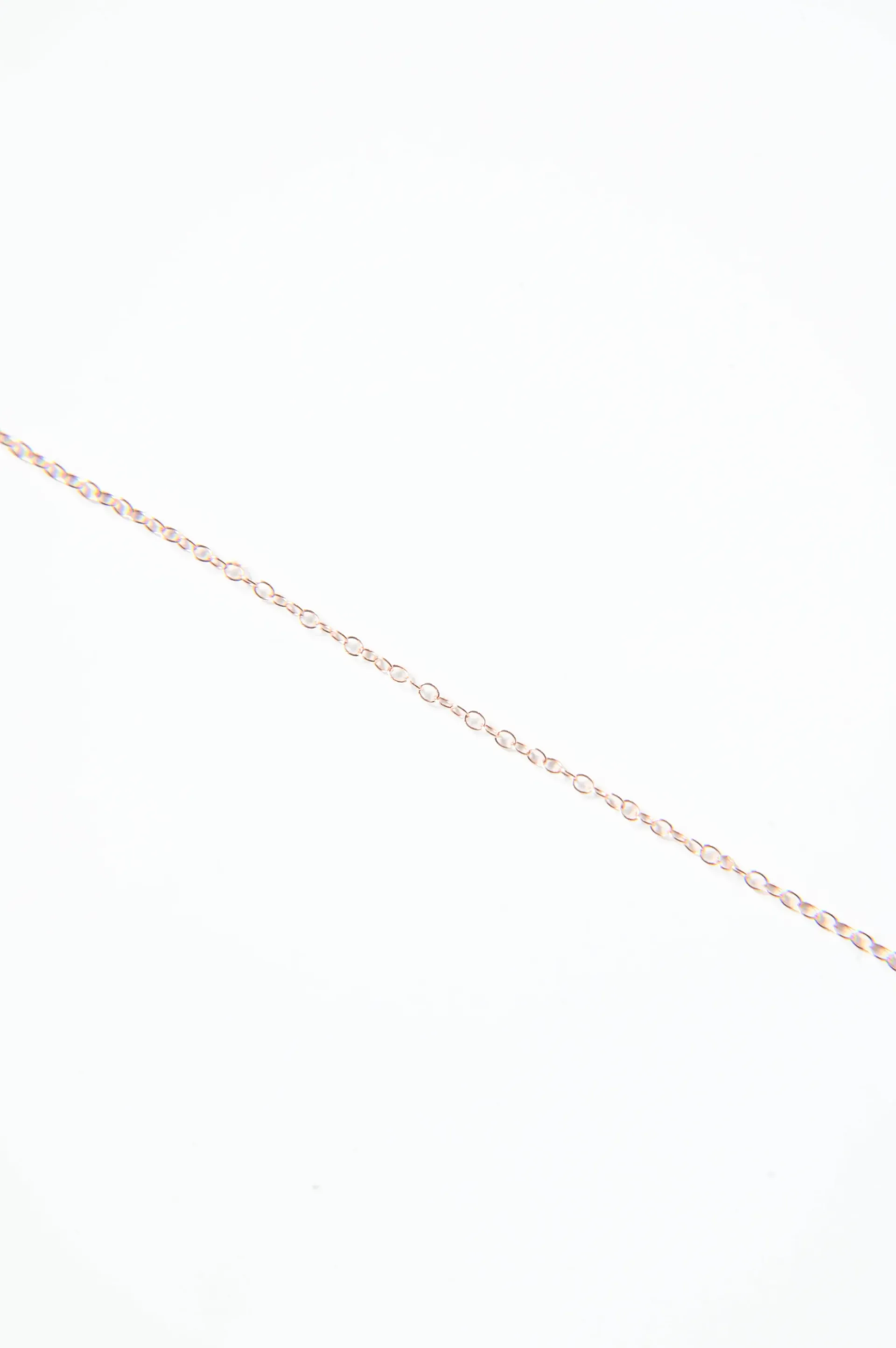 A close up of a chain on a white background.
