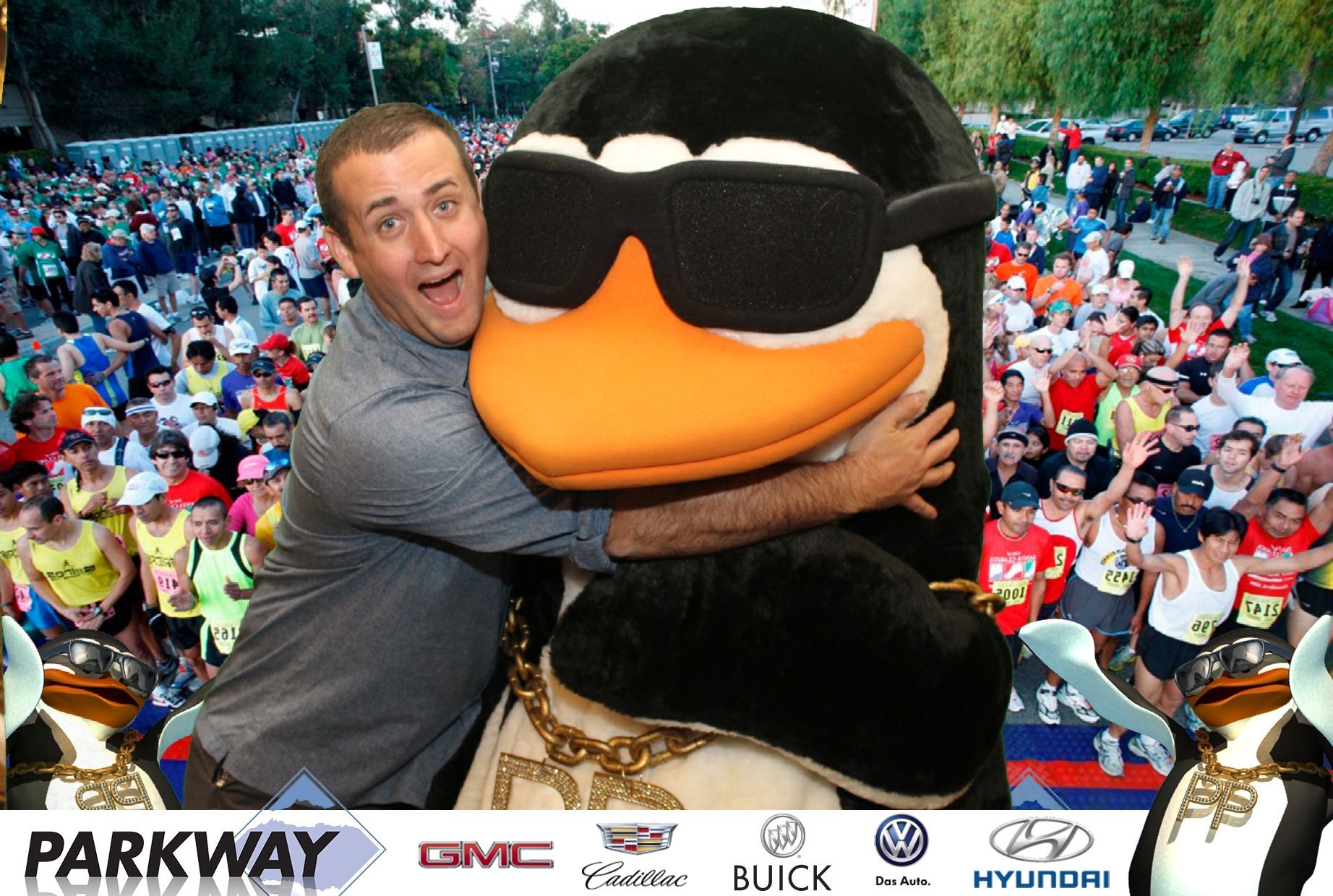 A man is hugging a stuffed penguin wearing sunglasses