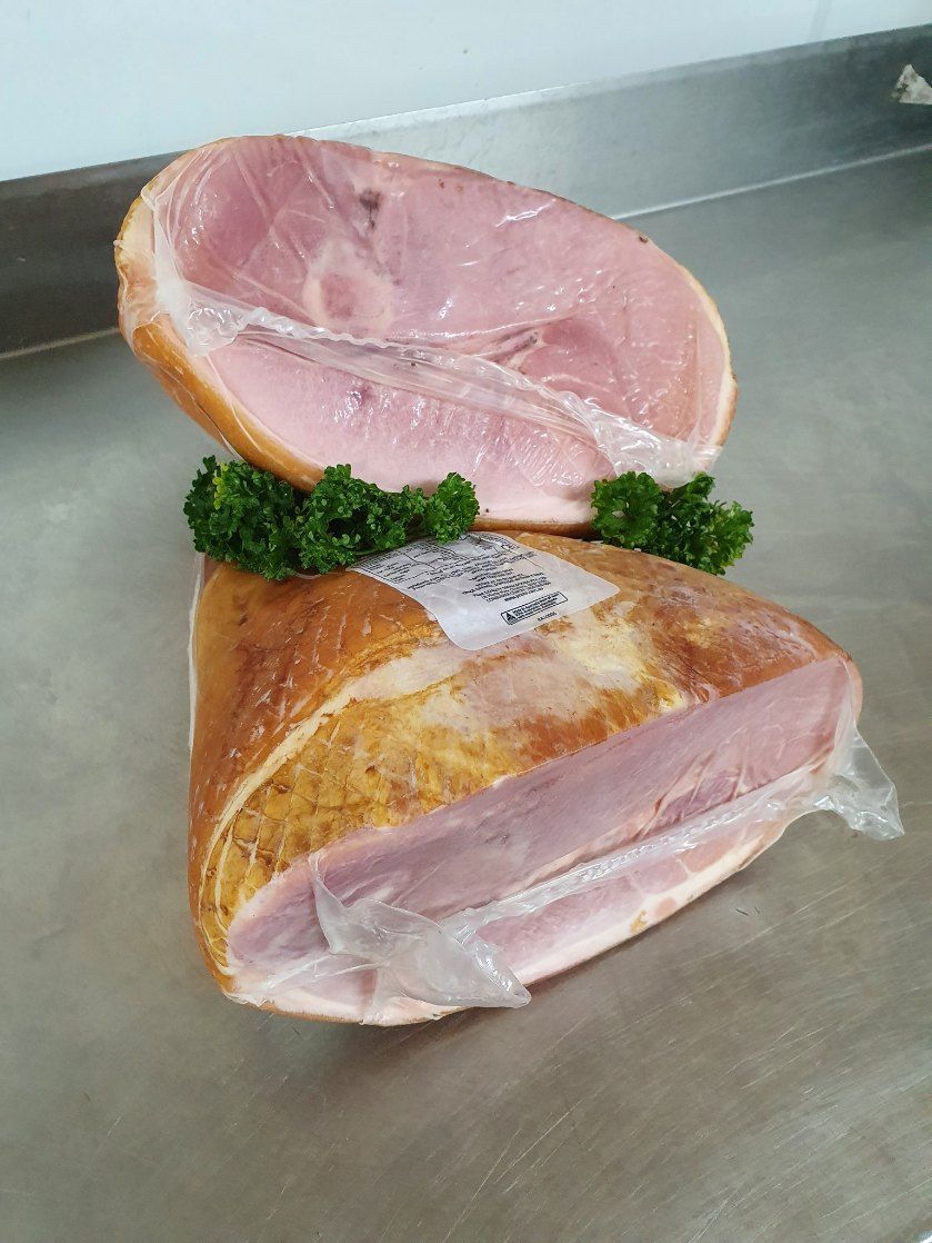 Two Pieces of Ham Are Stacked on Top of Each Other on a Counter — Fresco's Quality Meats (Retail) in Cairns, QLD