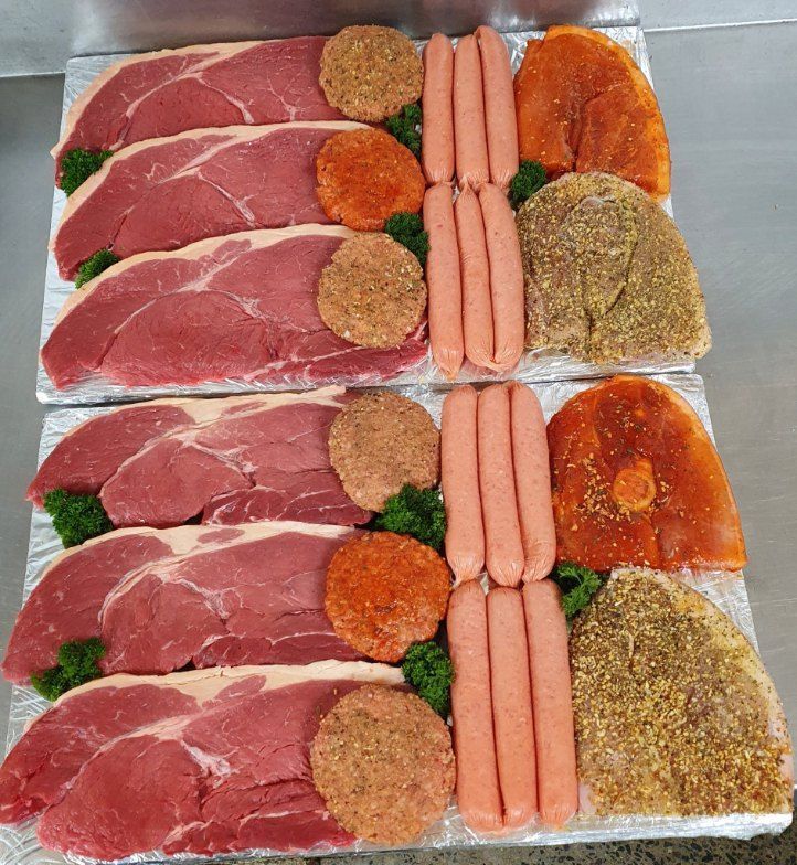 A Tray of Meat and Sausages on a Table — Fresco's Quality Meats (Retail) in Townsville, QLD