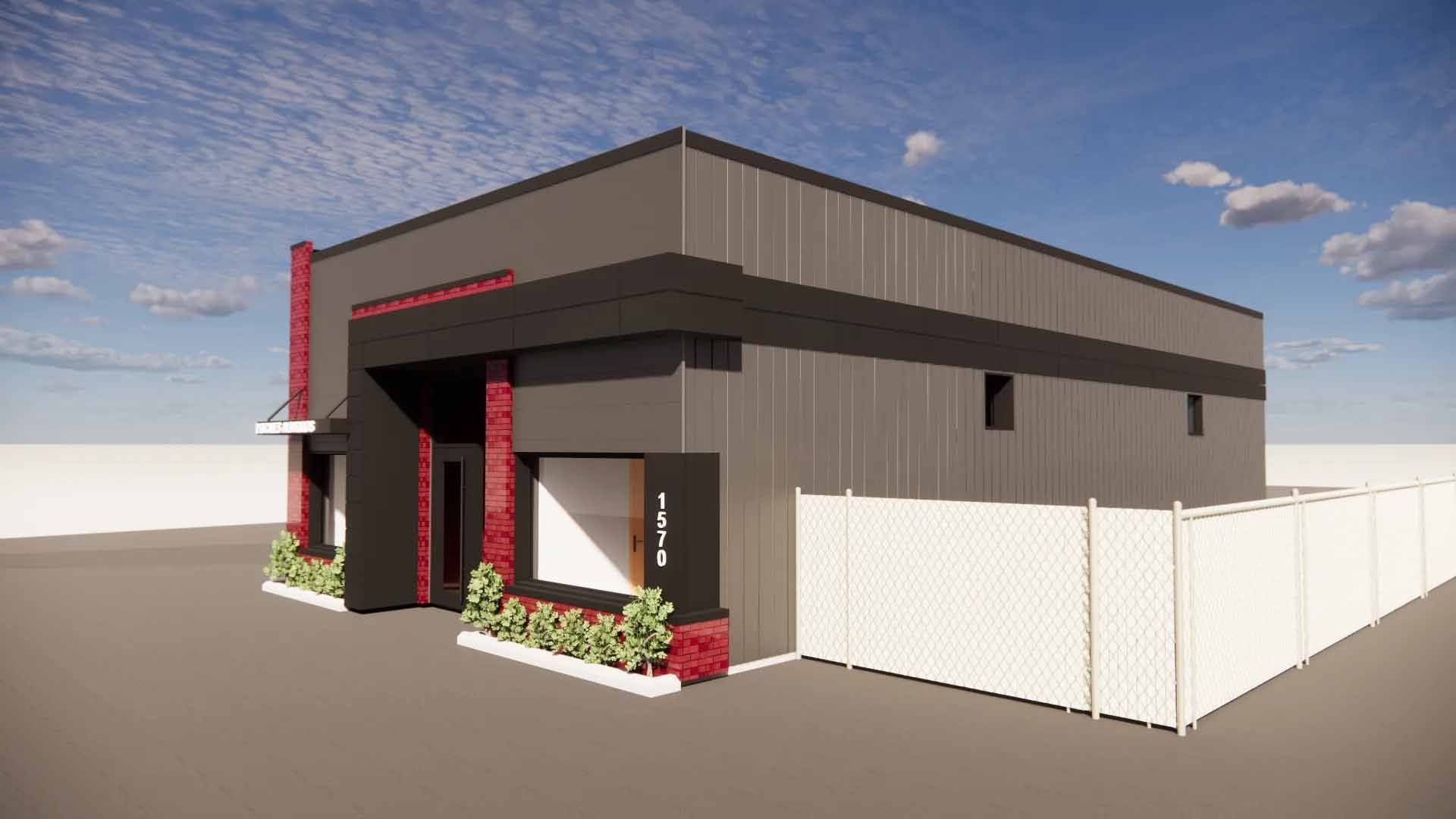 Bâtiment commercial moderne avec une façade gris foncé, des touches de rouge et une clôture blanche.