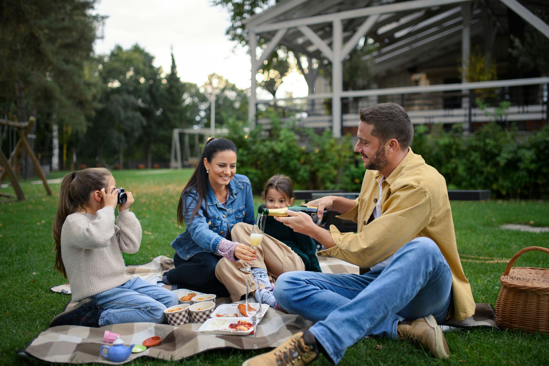 A family is having a picnic in the park.