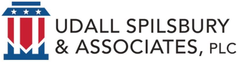 The logo for udall spilsbury & associates plc