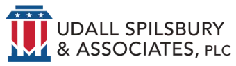The logo for udall spilsbury & associates , plc