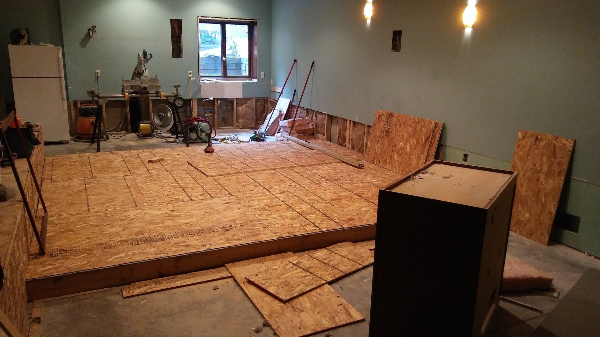 A room with a lot of plywood on the floor